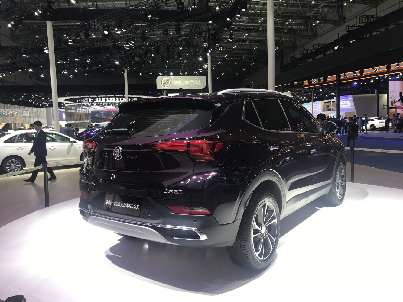 Rear and side profile of a sleek black SUV with alloy wheels and modern taillights