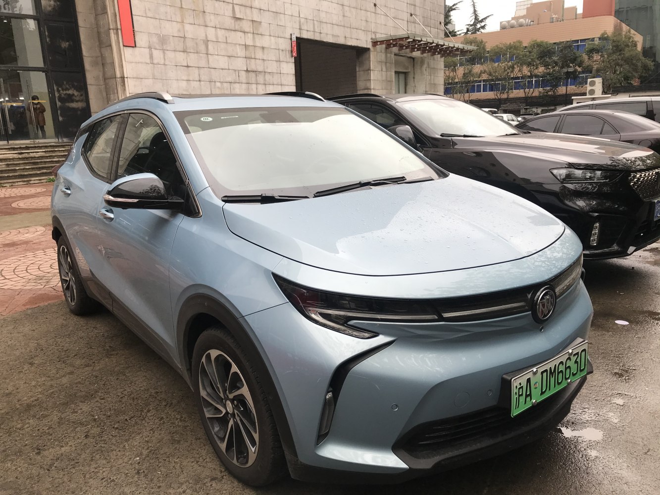 Front and side view of a sleek modern compact SUV with aerodynamic headlights and alloy wheels.