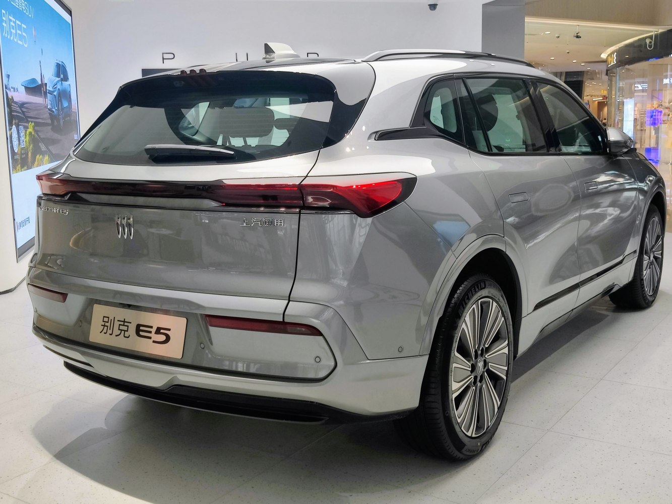Sleek rear profile with continuous LED tail lights and modern hatchback design