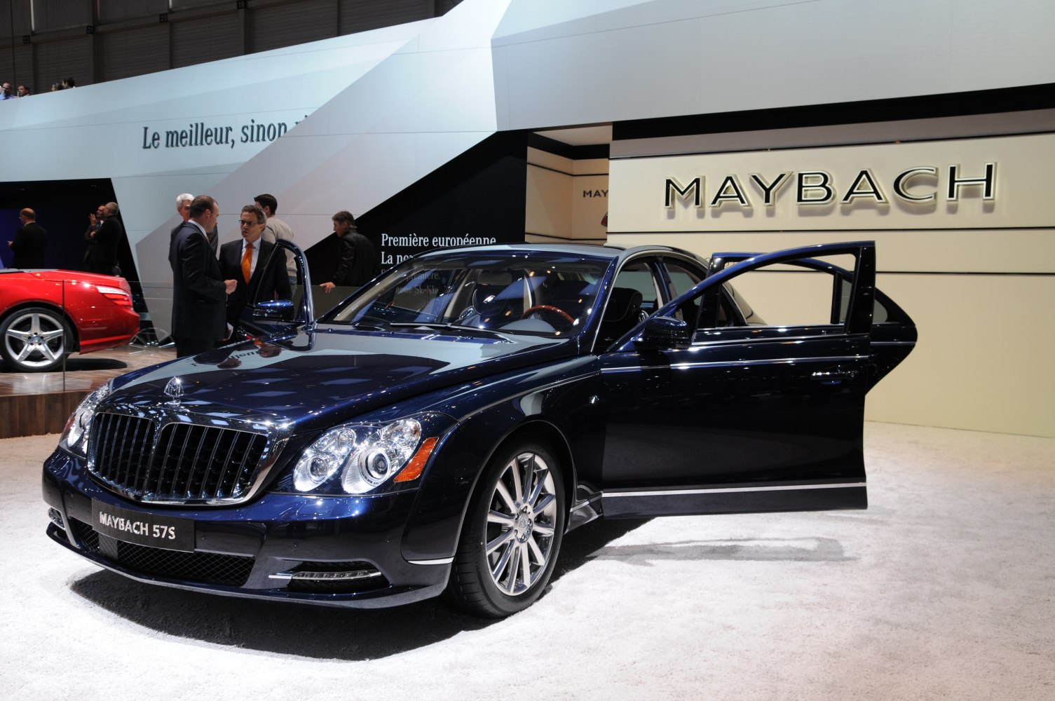 Front view of luxury sedan with distinctive grille and opened doors