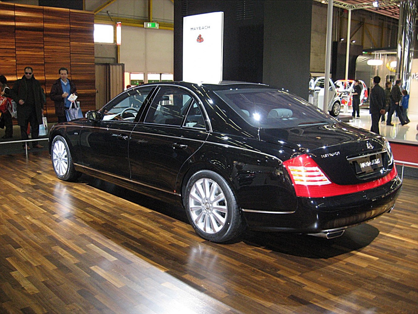 Luxury sedan rear view with sleek tail lights and alloy wheels