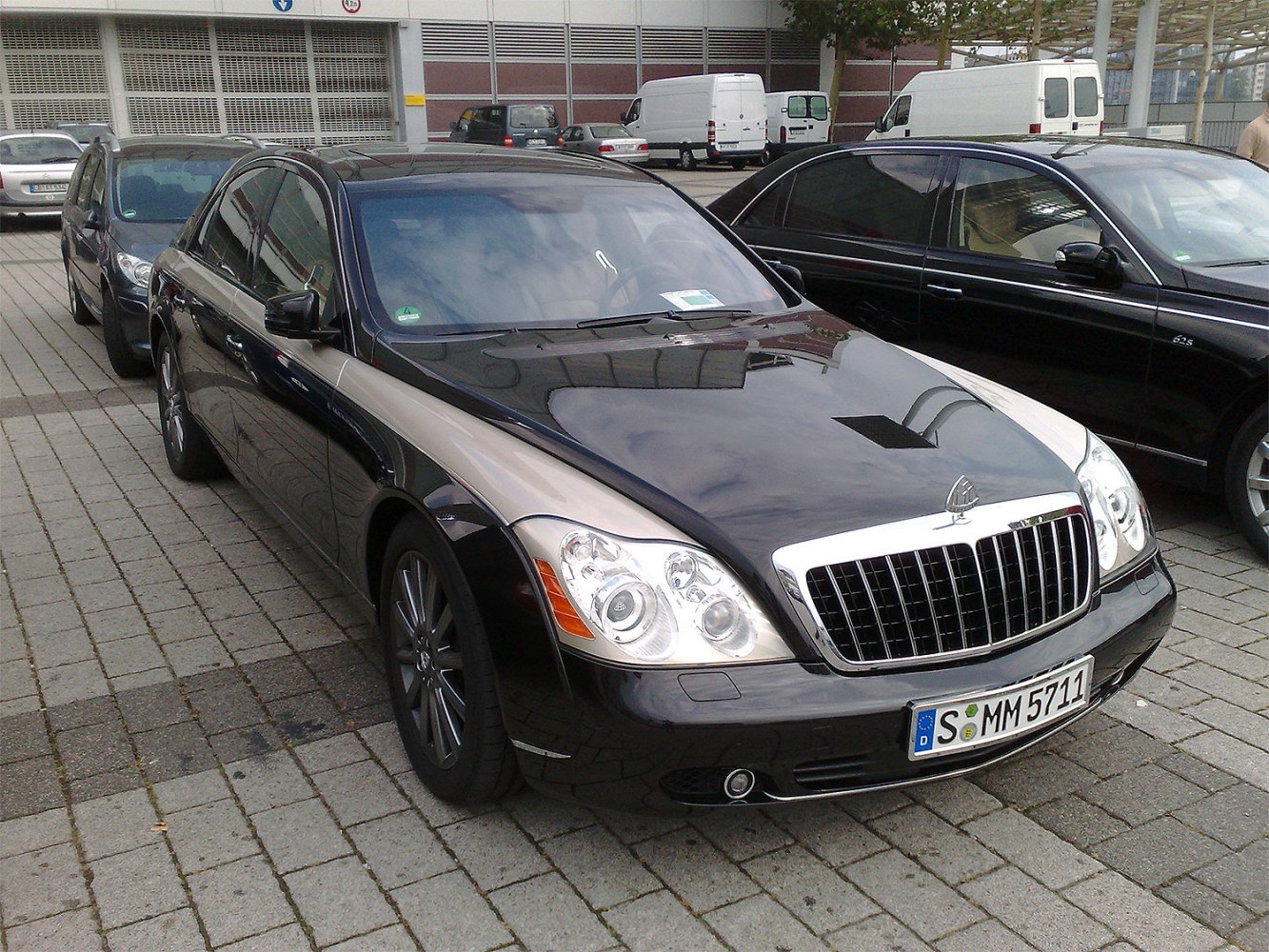 Two-tone luxury sedan with Maybach grille and distinct headlights