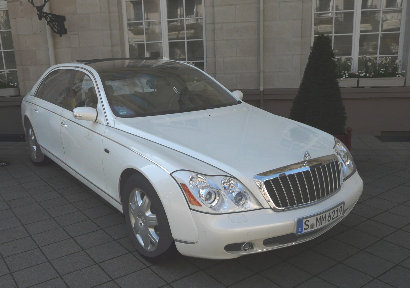 Luxury sedan with prominent chrome grille and sleek side profile.