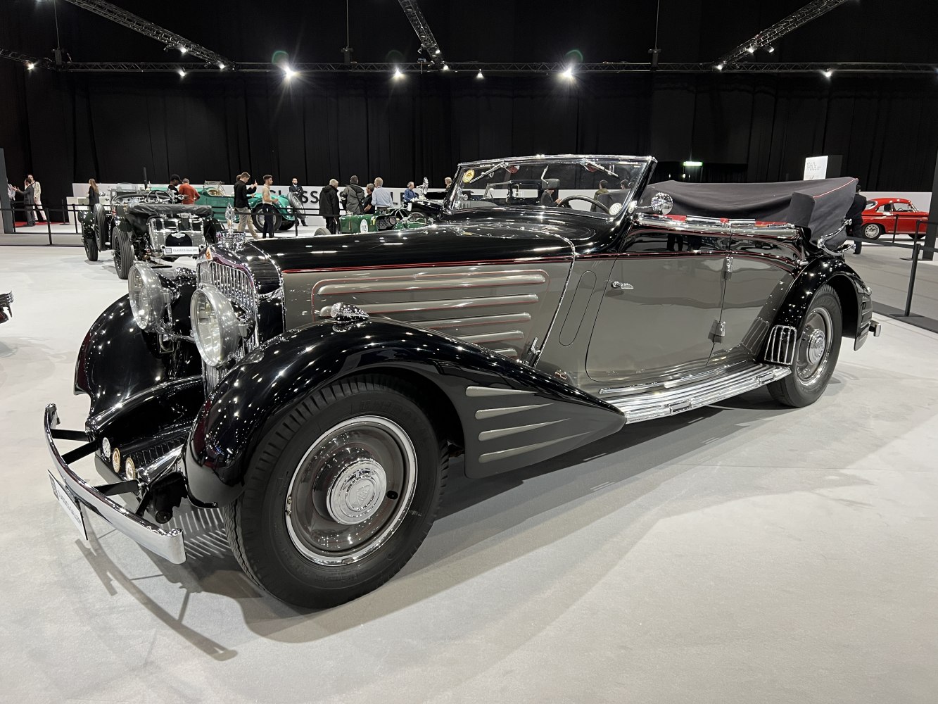 Vintage convertible with black and chrome finish and elongated hood