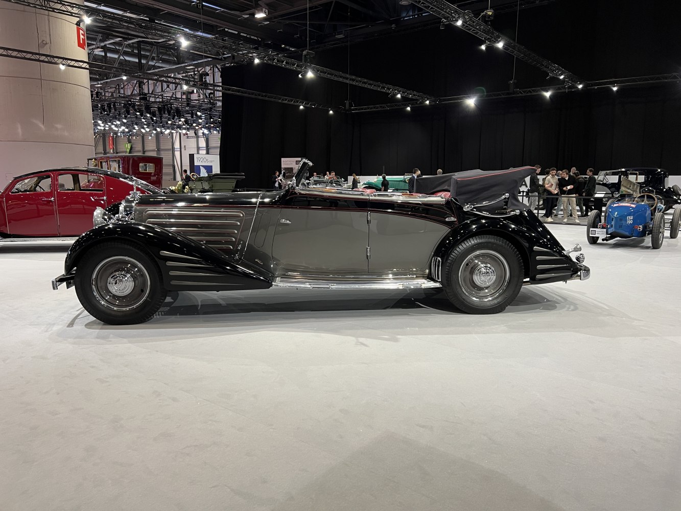 Vintage convertible with flowing front fenders and elongated body