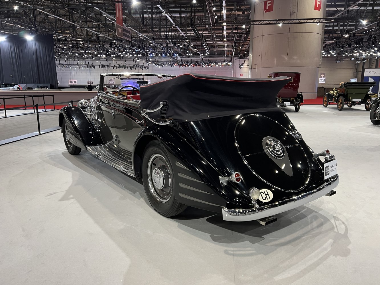 Classic vintage convertible with soft top and rounded rear design