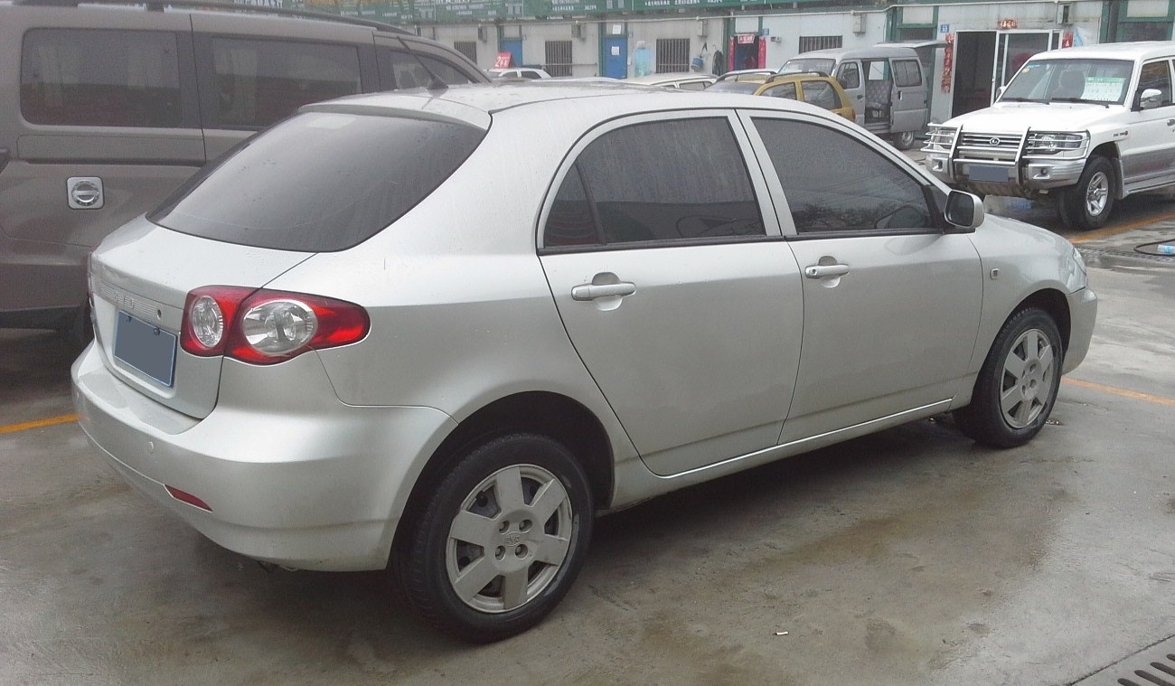 Hatchback rear side with taillights and tinted windows