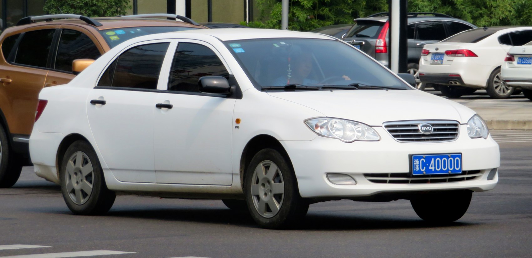 White compact sedan with front and side visible, neat design.