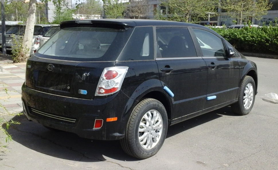 Rear side profile of black electric vehicle with silver wheels