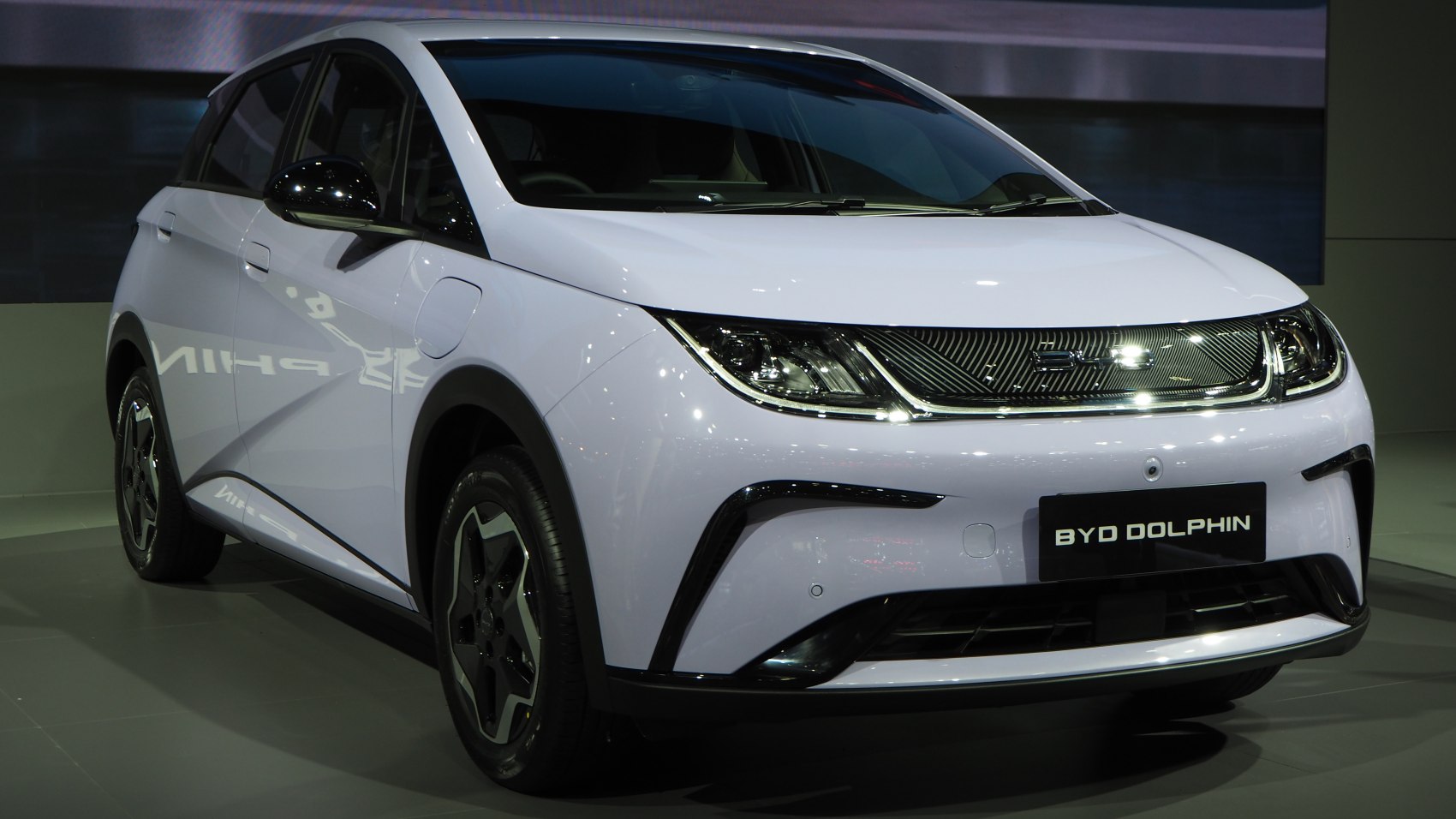 Modern compact electric hatchback with LED headlights and smooth aerodynamic design