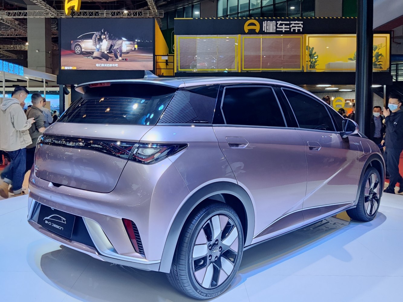 Sleek rear and side design with tinted windows and distinctive alloy wheels