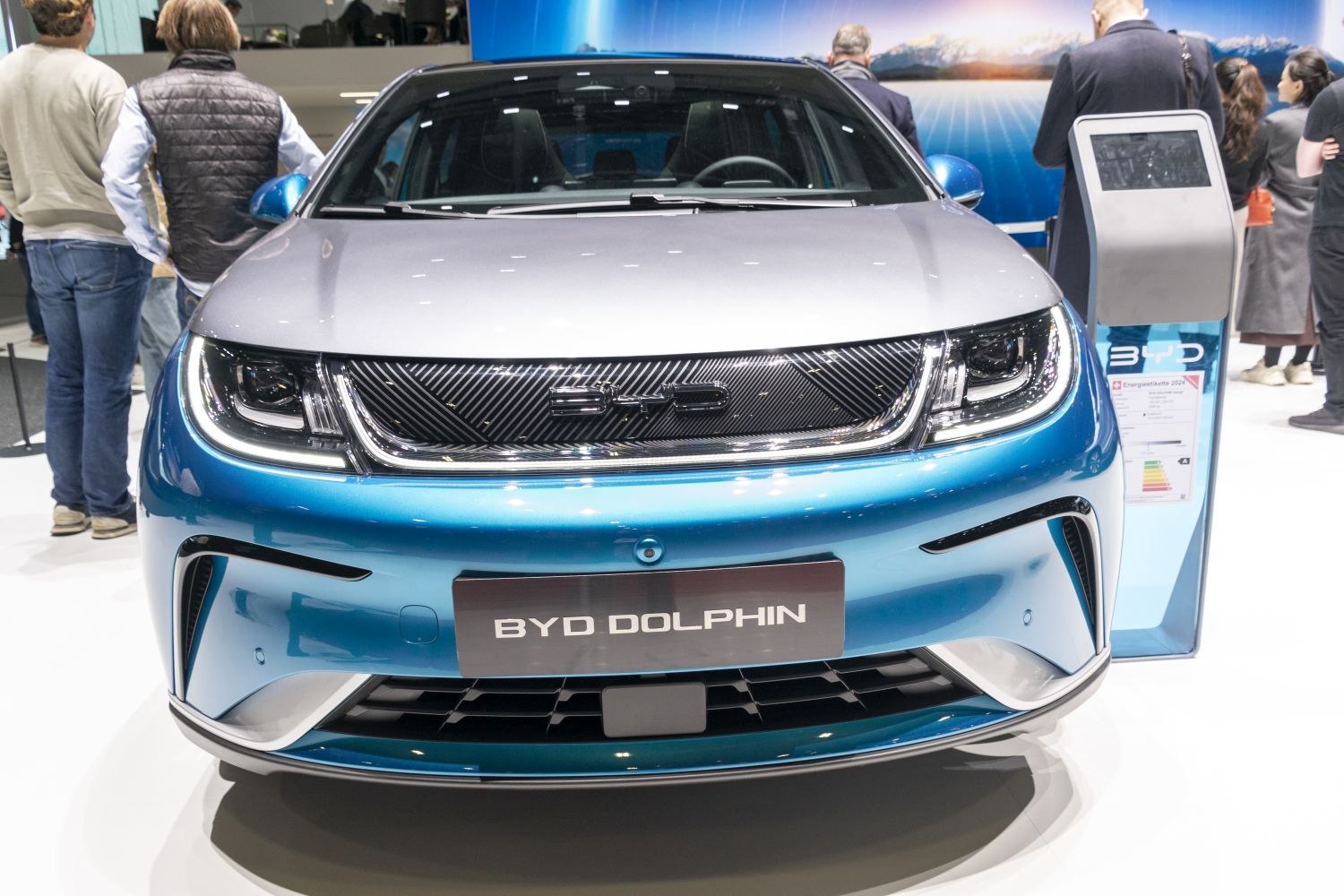 Modern front grille and LED headlights of an electric hatchback
