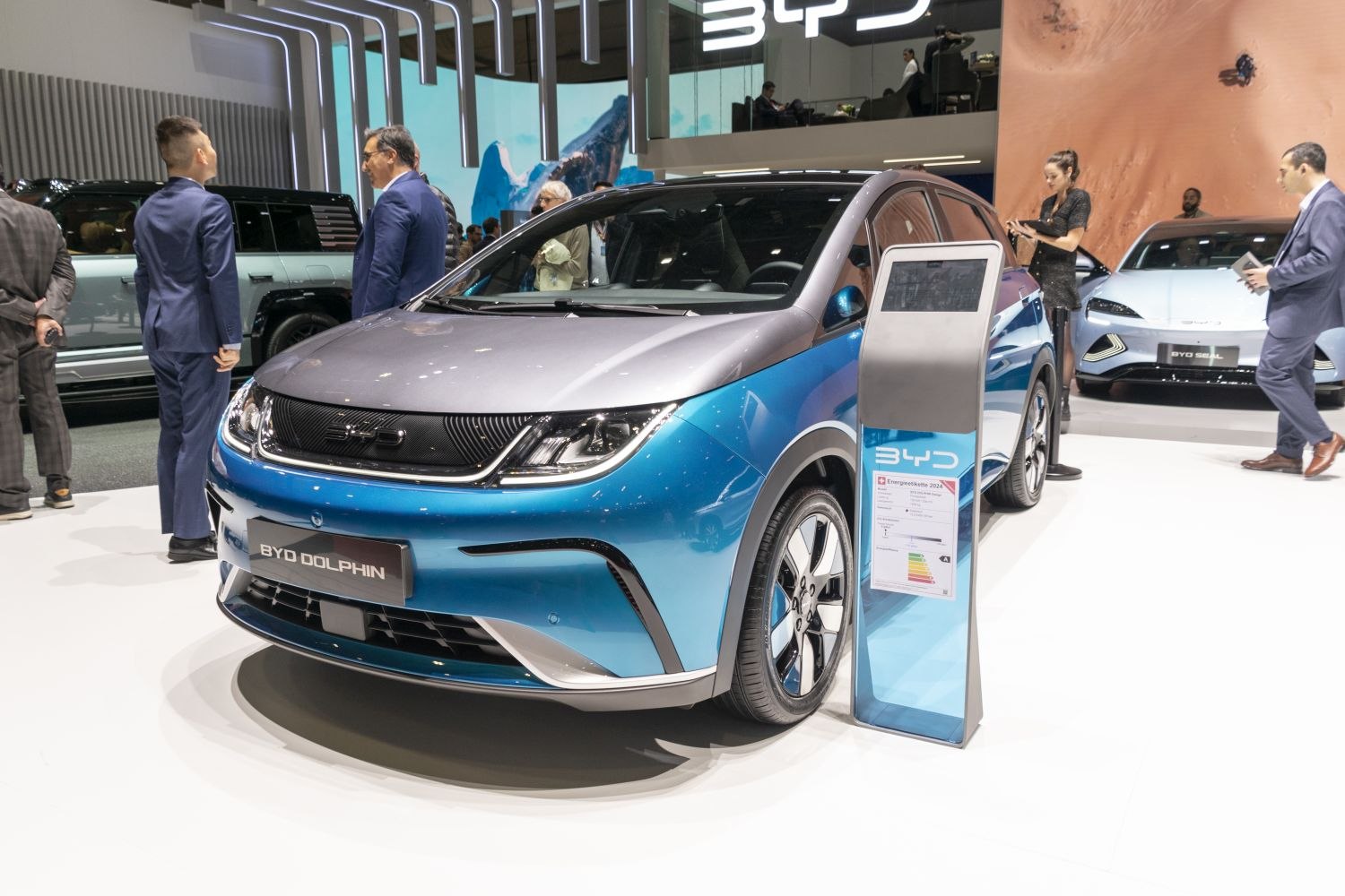 Front and side view of electric vehicle with LED headlights and sleek design