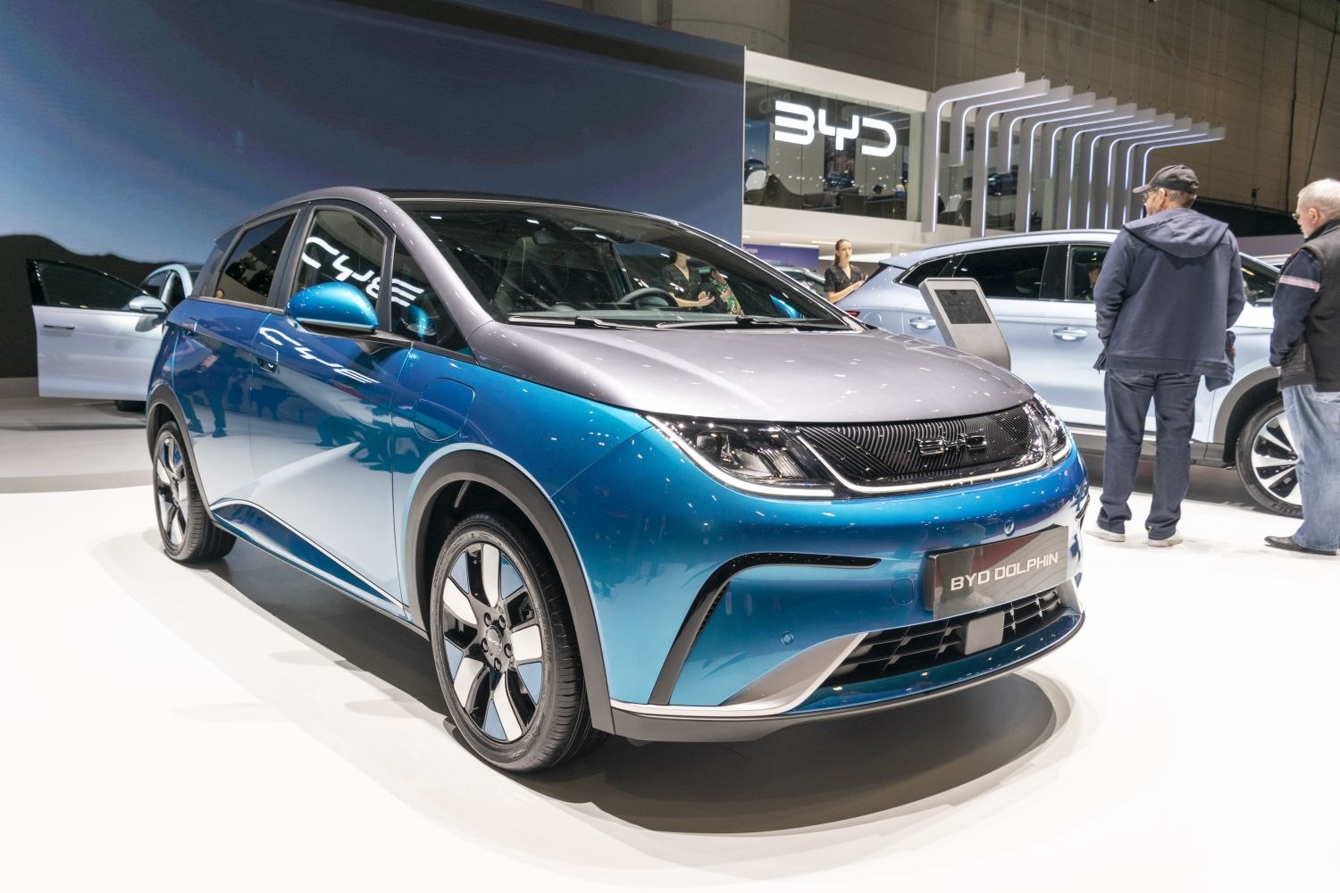 Blue silver electric hatchback with sleek headlights and modern wheels