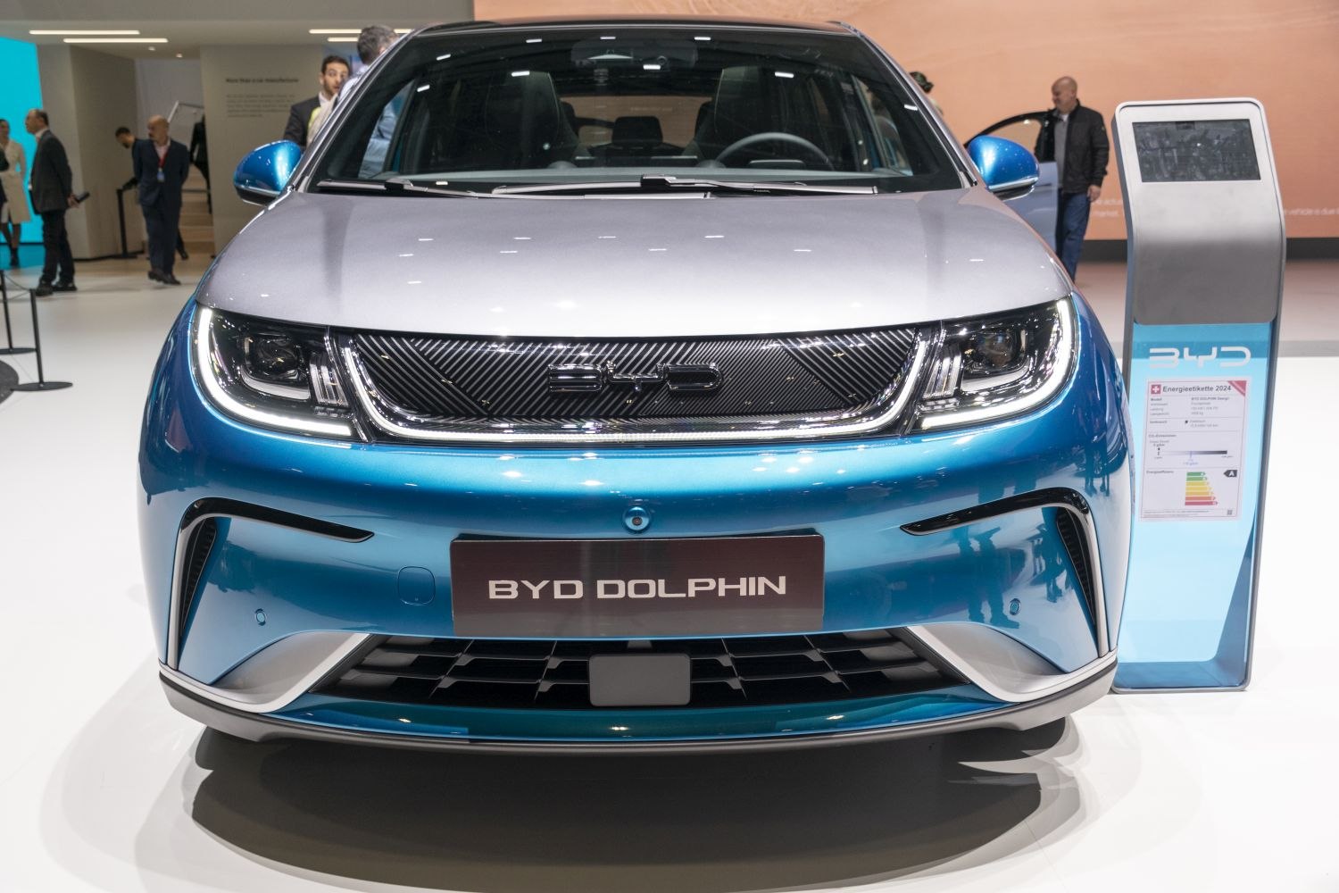 Front grille and LED headlights of a modern compact electric car