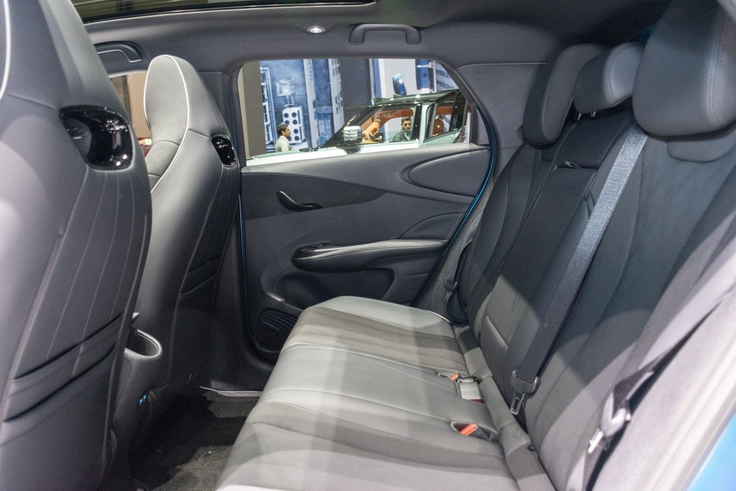 Rear seating and door panel with armrest and seatbelts