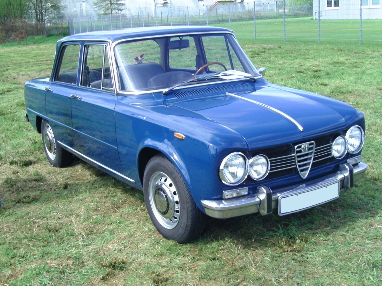 Vintage sedan with quad round headlights and chrome bumper
