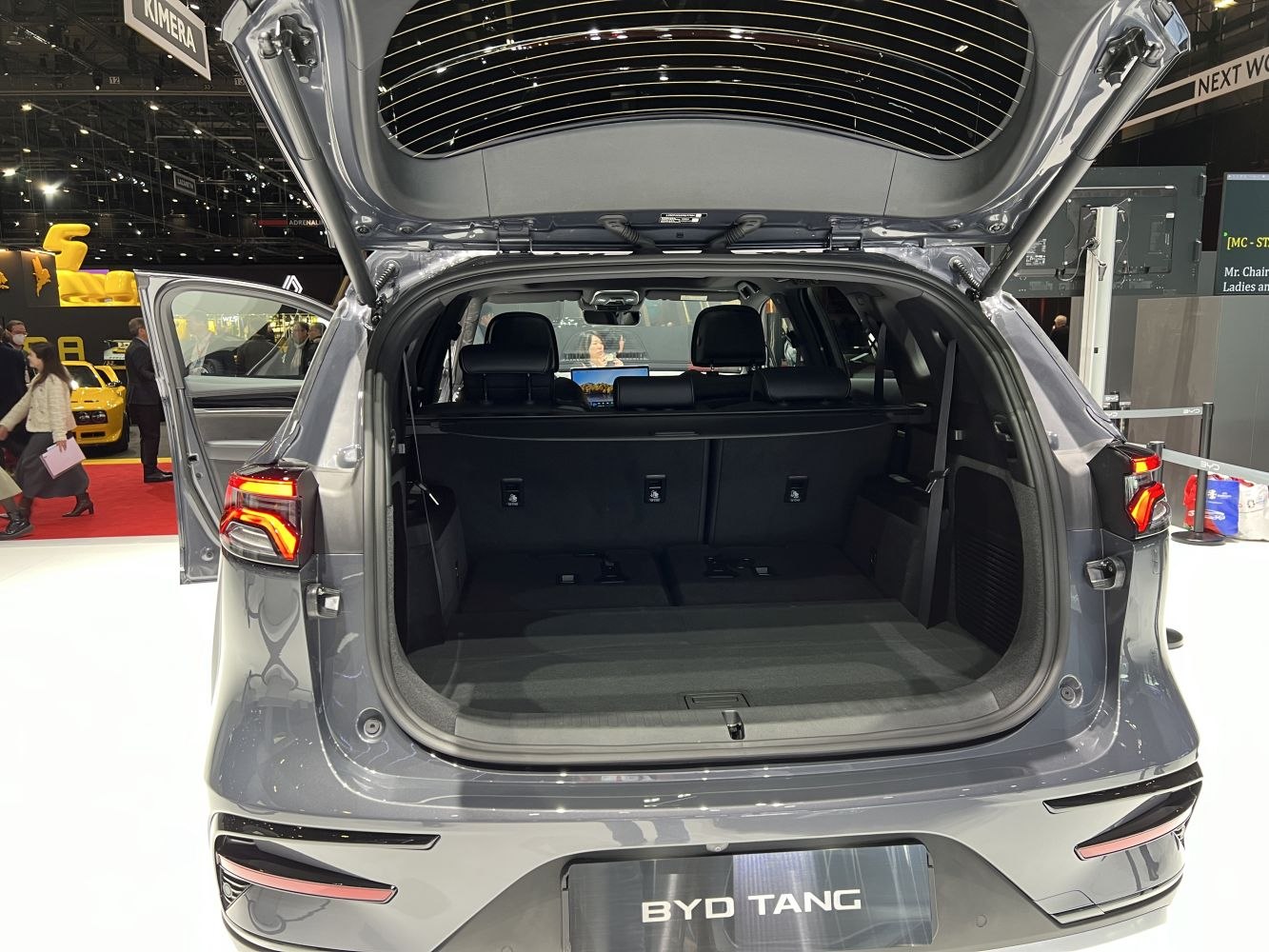 Open rear hatch with large spacious cargo area and visible seats.