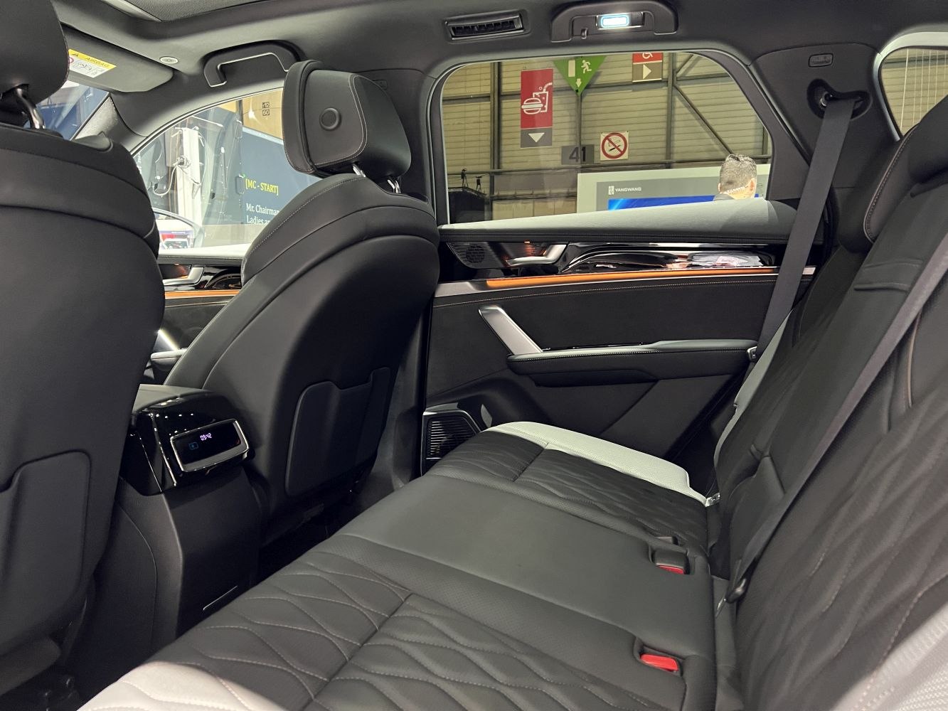 Rear passenger seating with premium upholstery and modern interior features