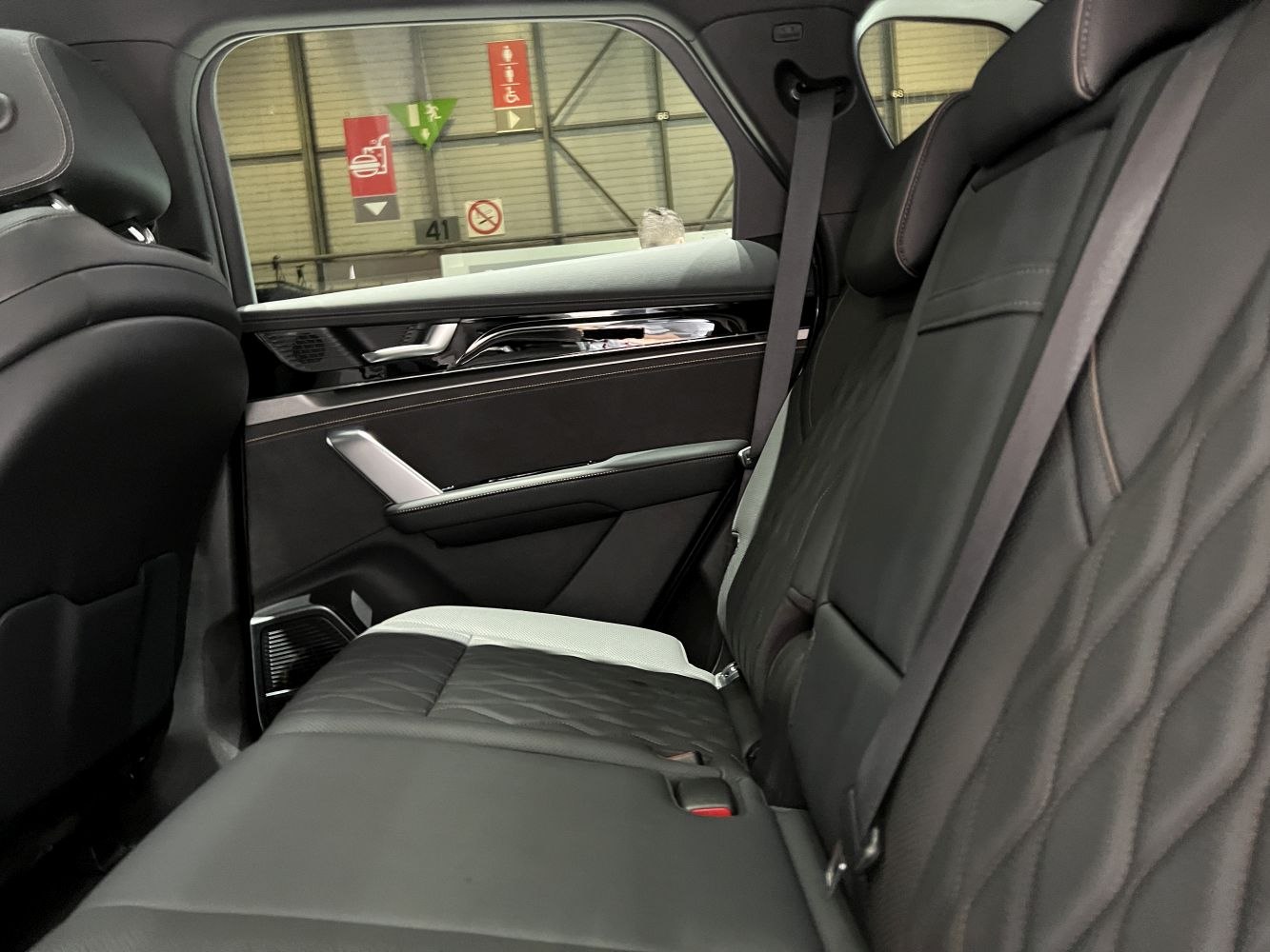 Rear leather seats and door panel in modern SUV interior