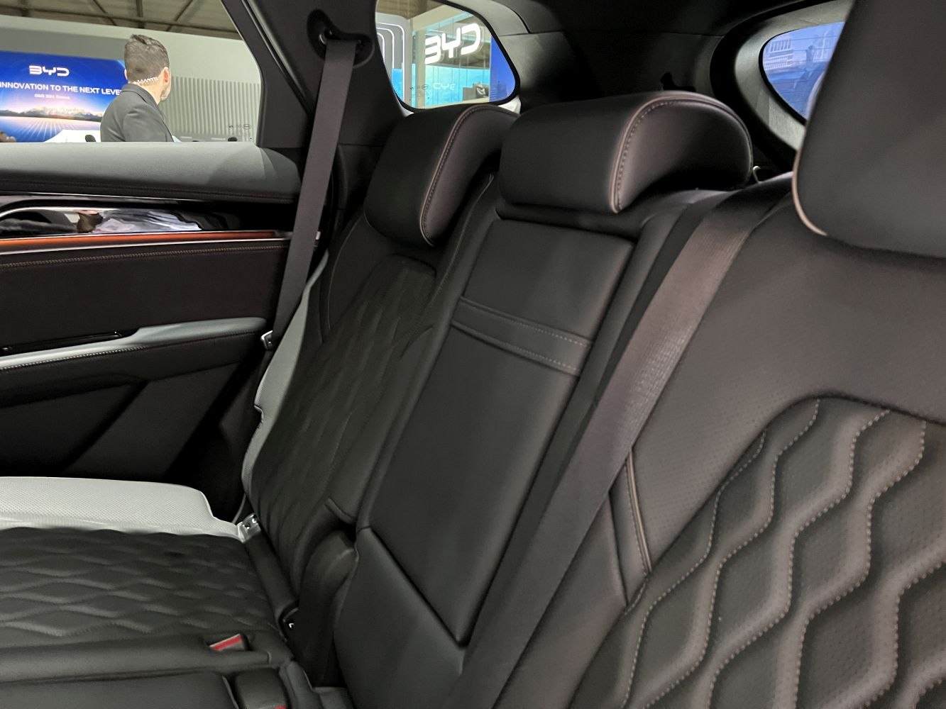 Quilted leather rear seats with headrests and seatbelts.