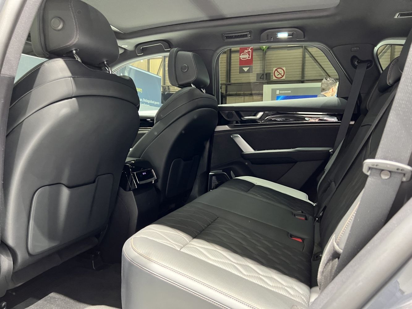 Modern rear interior with premium leather seats and spacious design