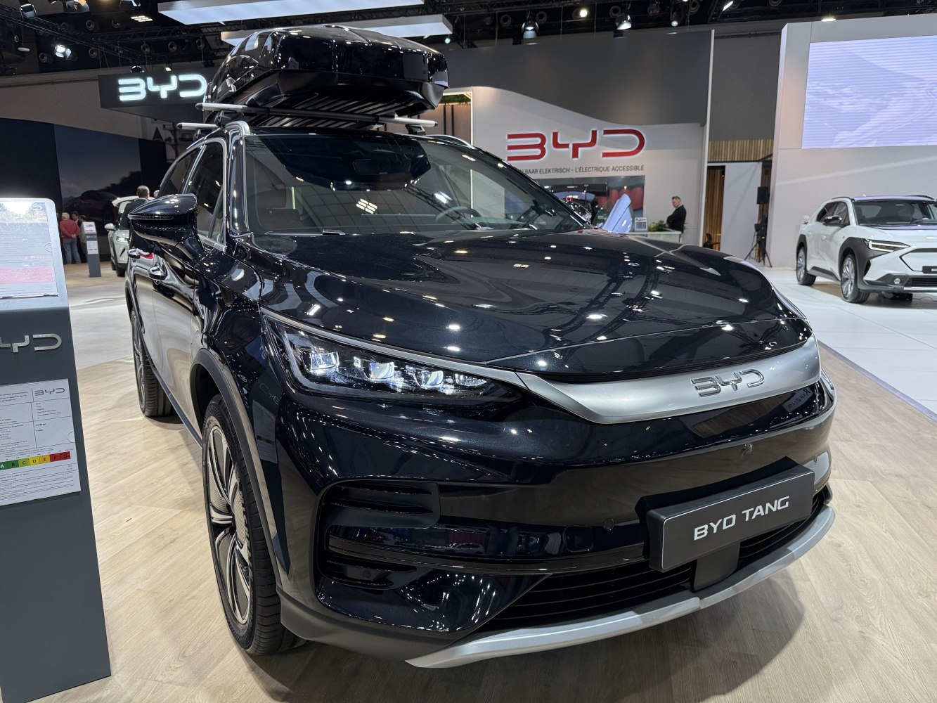Front view of modern SUV with LED headlights and roof box