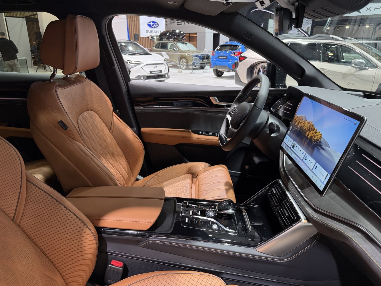 Premium tan leather seats and digital touchscreen dashboard