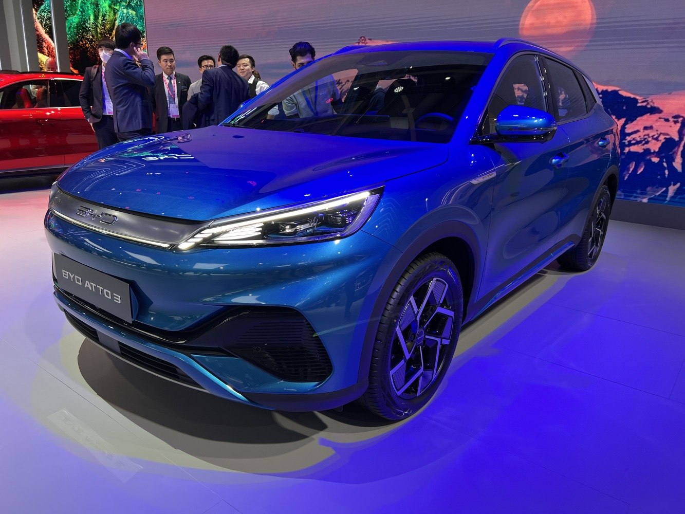 Aerodynamic front and side view with futuristic headlights and alloy wheels.