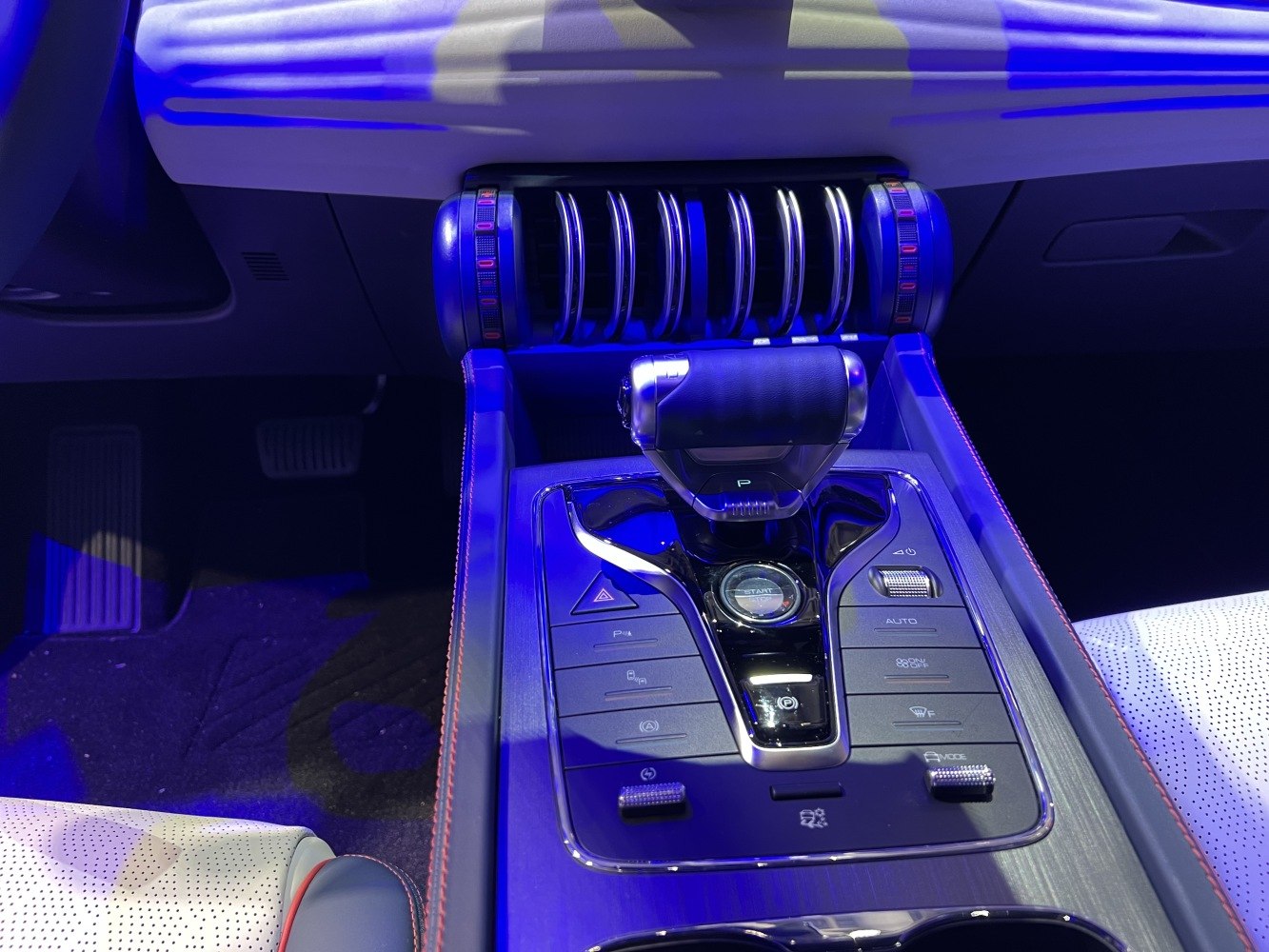 Center console with gear shifter and control buttons.