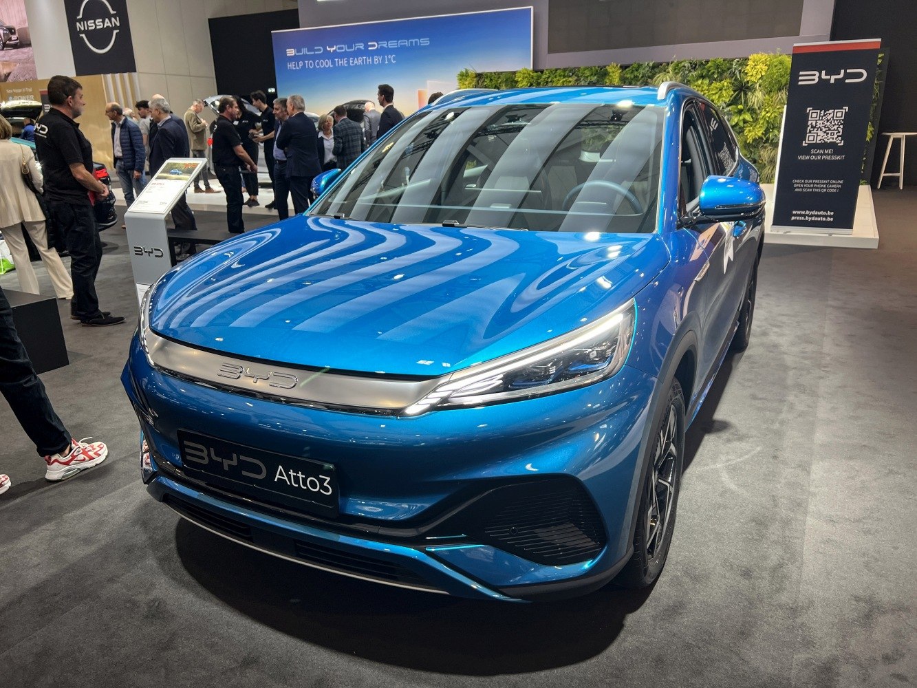 Sleek electric SUV front with sharp LED headlights and modern design
