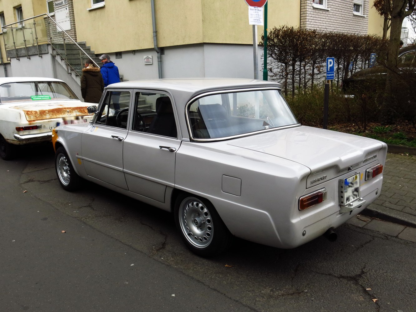 Rear and side view of classic vintage sedan with distinctive lines and taillights