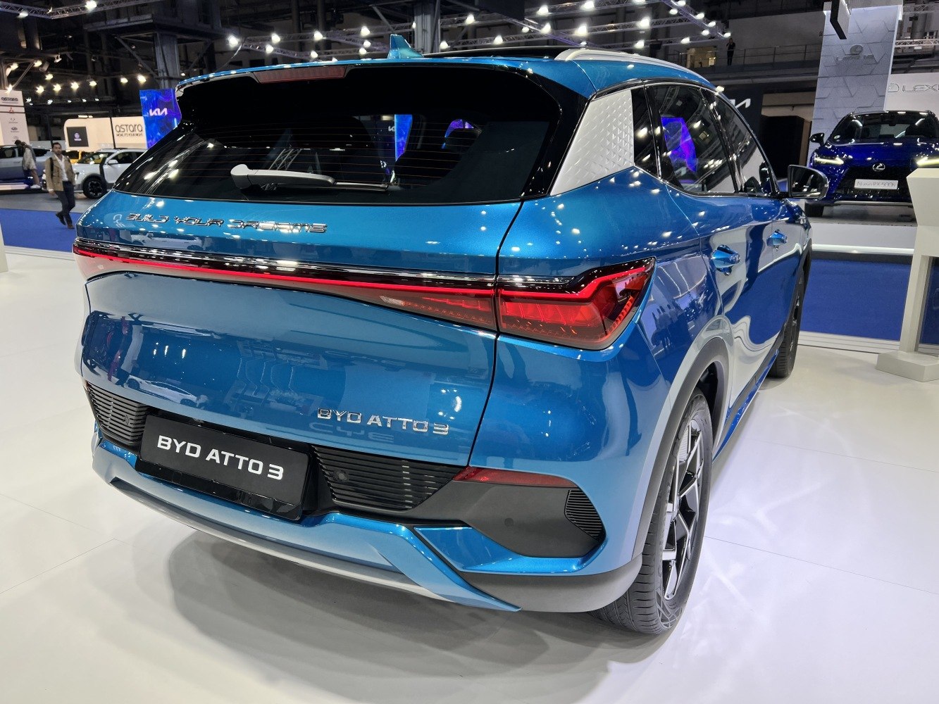 Rear of blue SUV with continuous LED light bar and aerodynamic styling