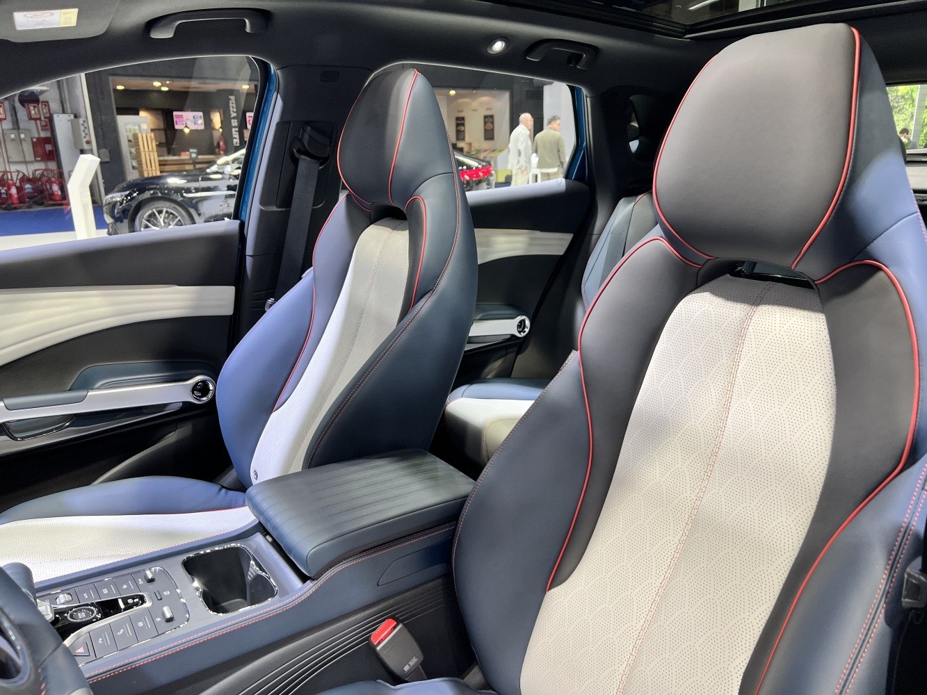 Sporty front seats with red stitching and perforated upholstery