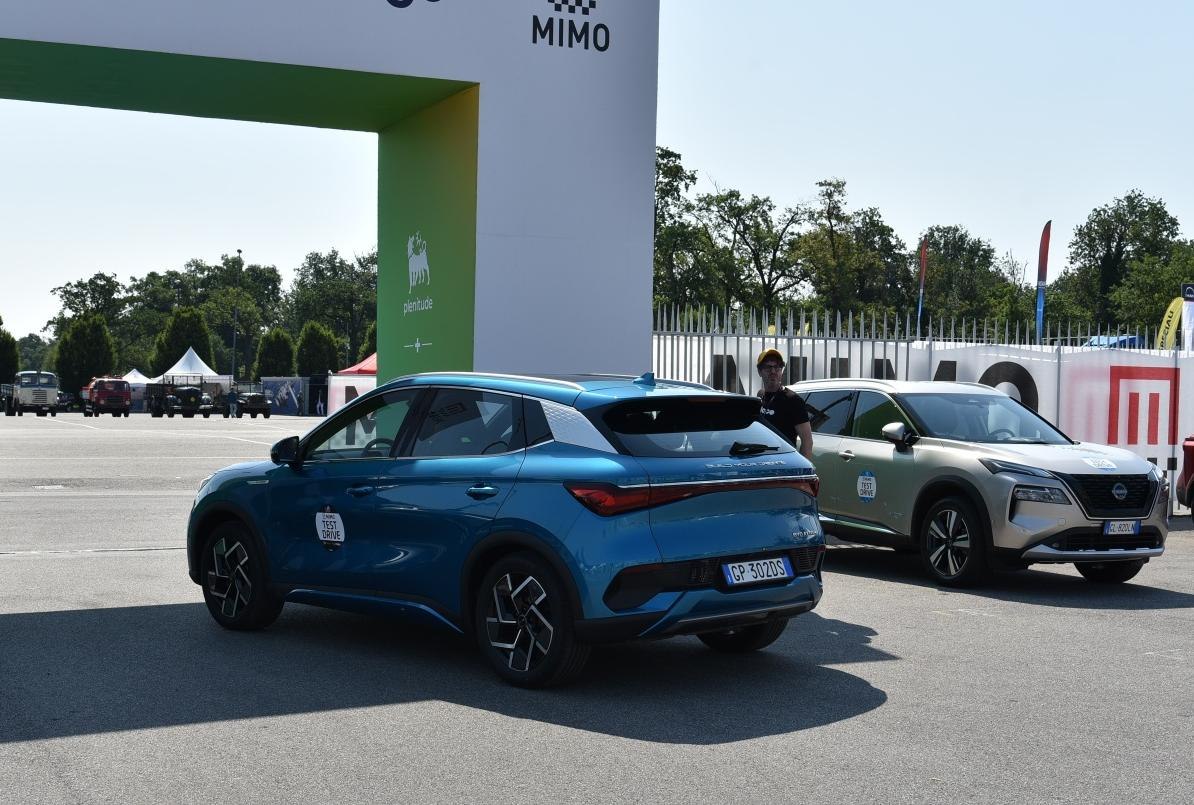 Rear view of a blue compact SUV with angular taillights and alloy wheels