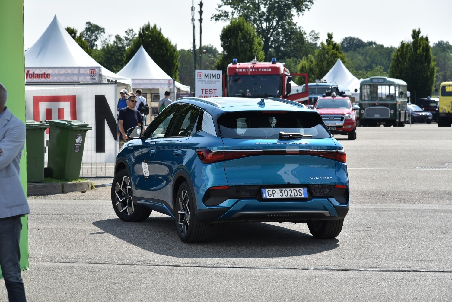 Modern crossover SUV rear with LED tail light strip and rear window wiper.