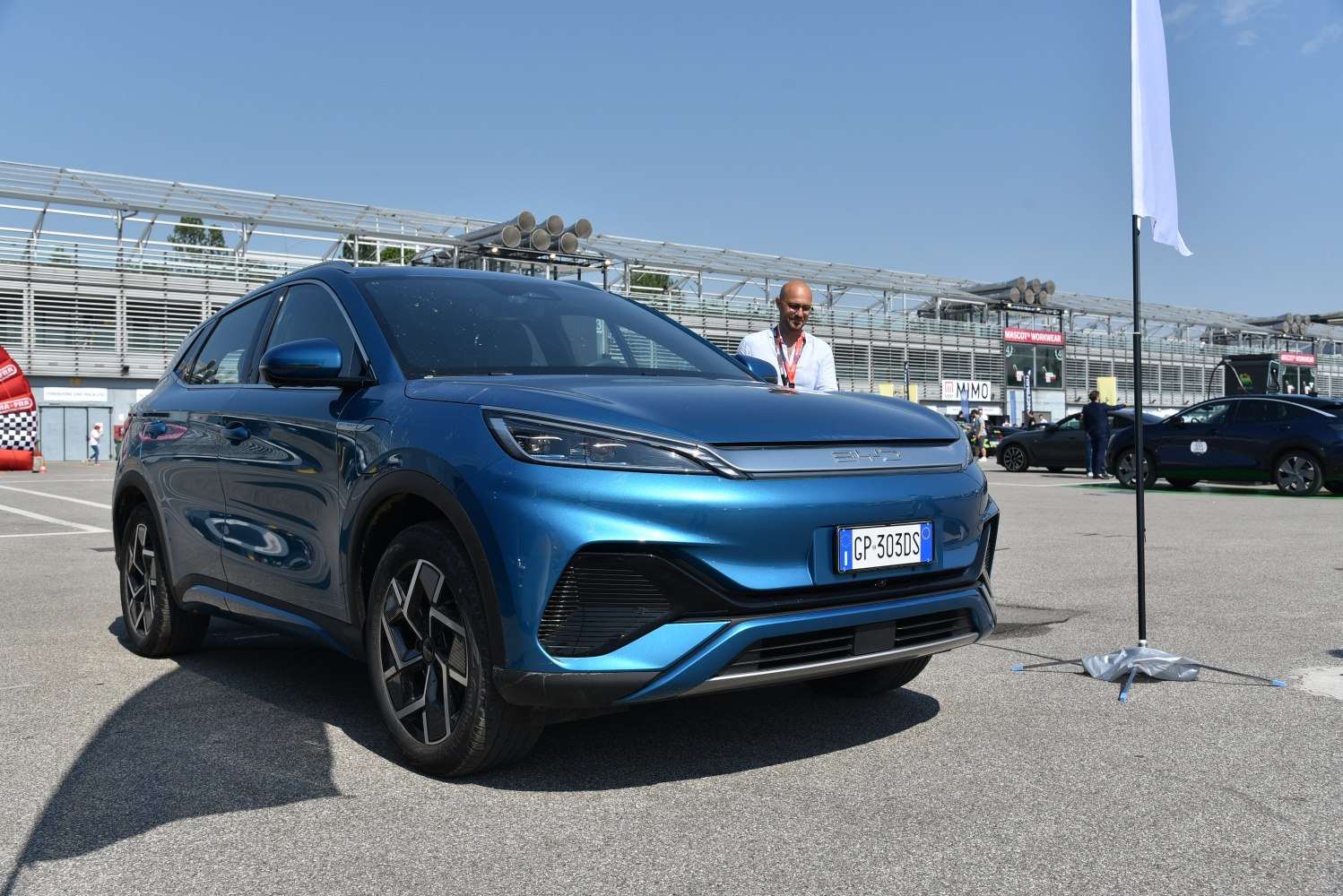 Front three-quarter view of modern electric SUV with aerodynamic headlights and alloy wheels