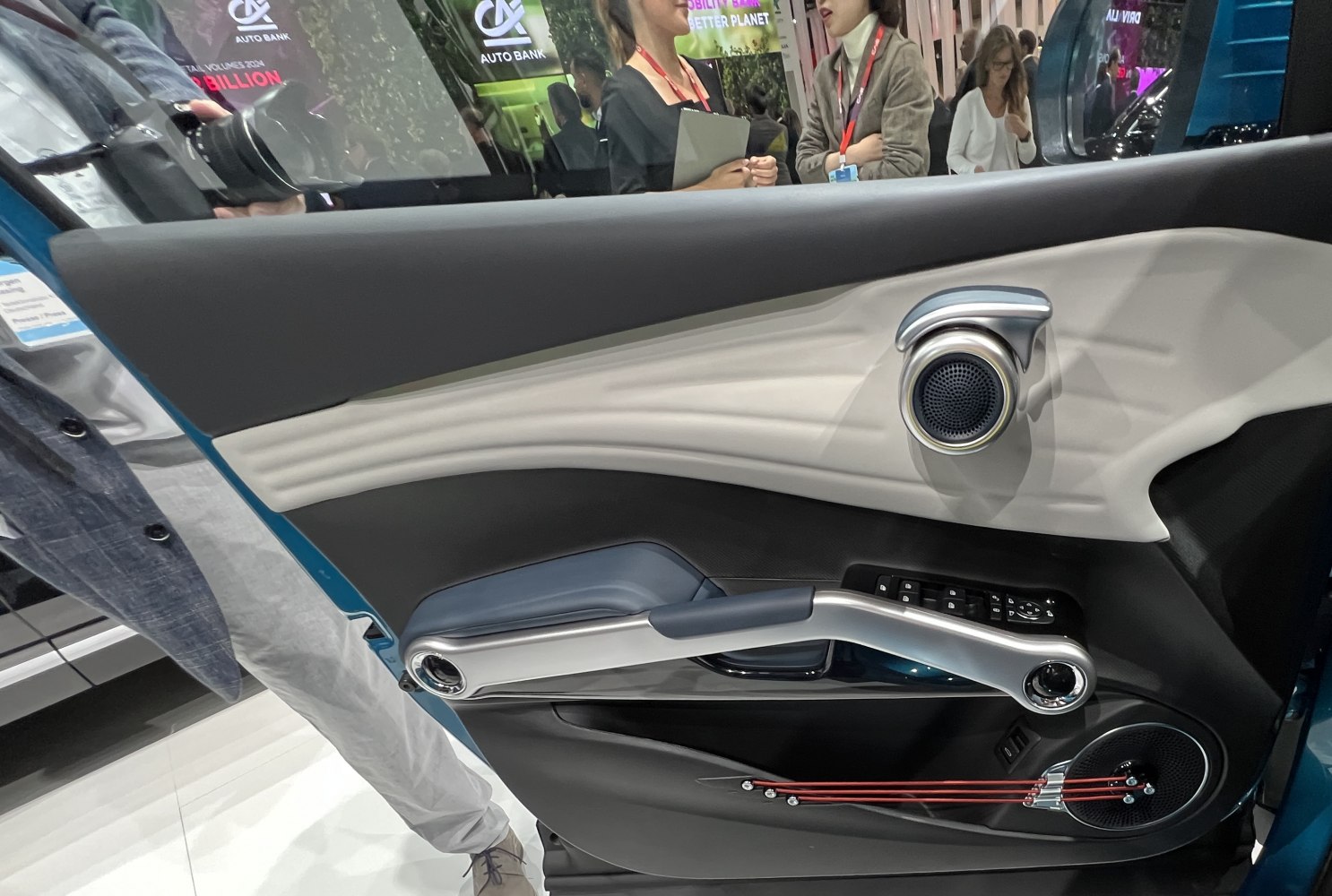 Interior door panel with modern speakers and controls in a unique design