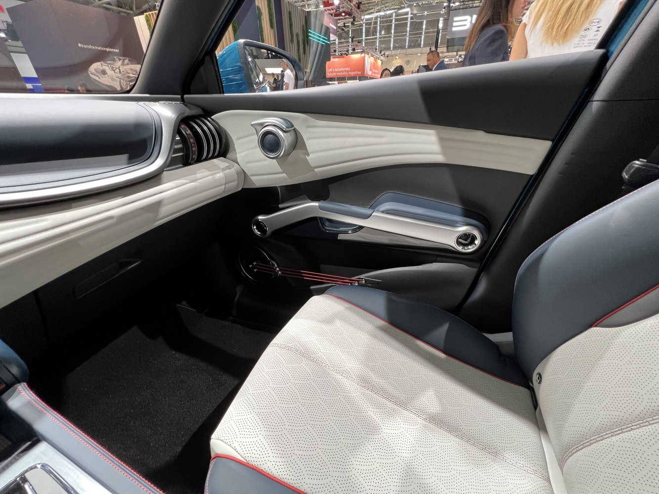 Passenger side door panel and seat interior with modern design features