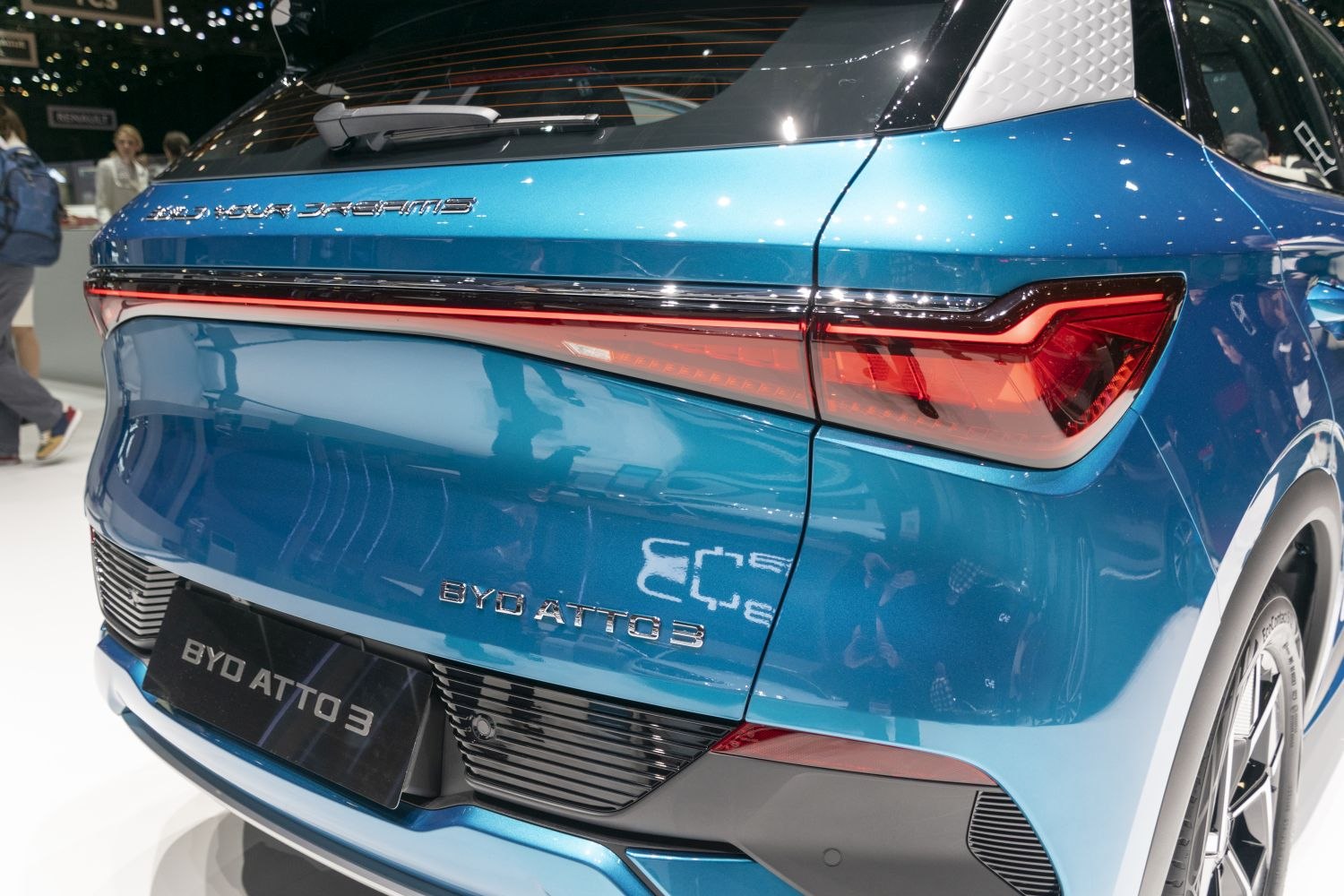 LED tail lights and rear hatch of a blue vehicle
