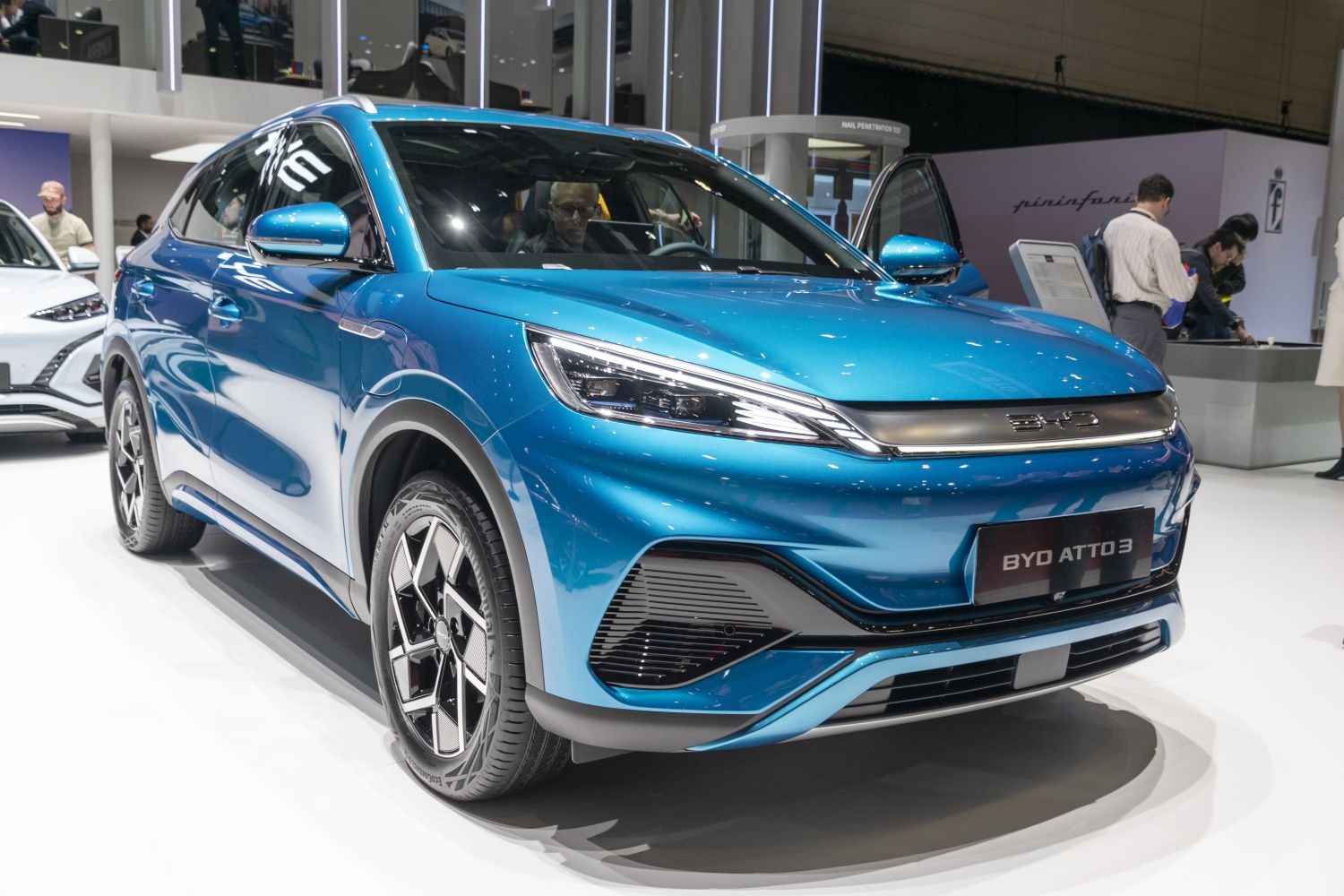 Electric SUV front three-quarter view with LED headlights and aerodynamic design