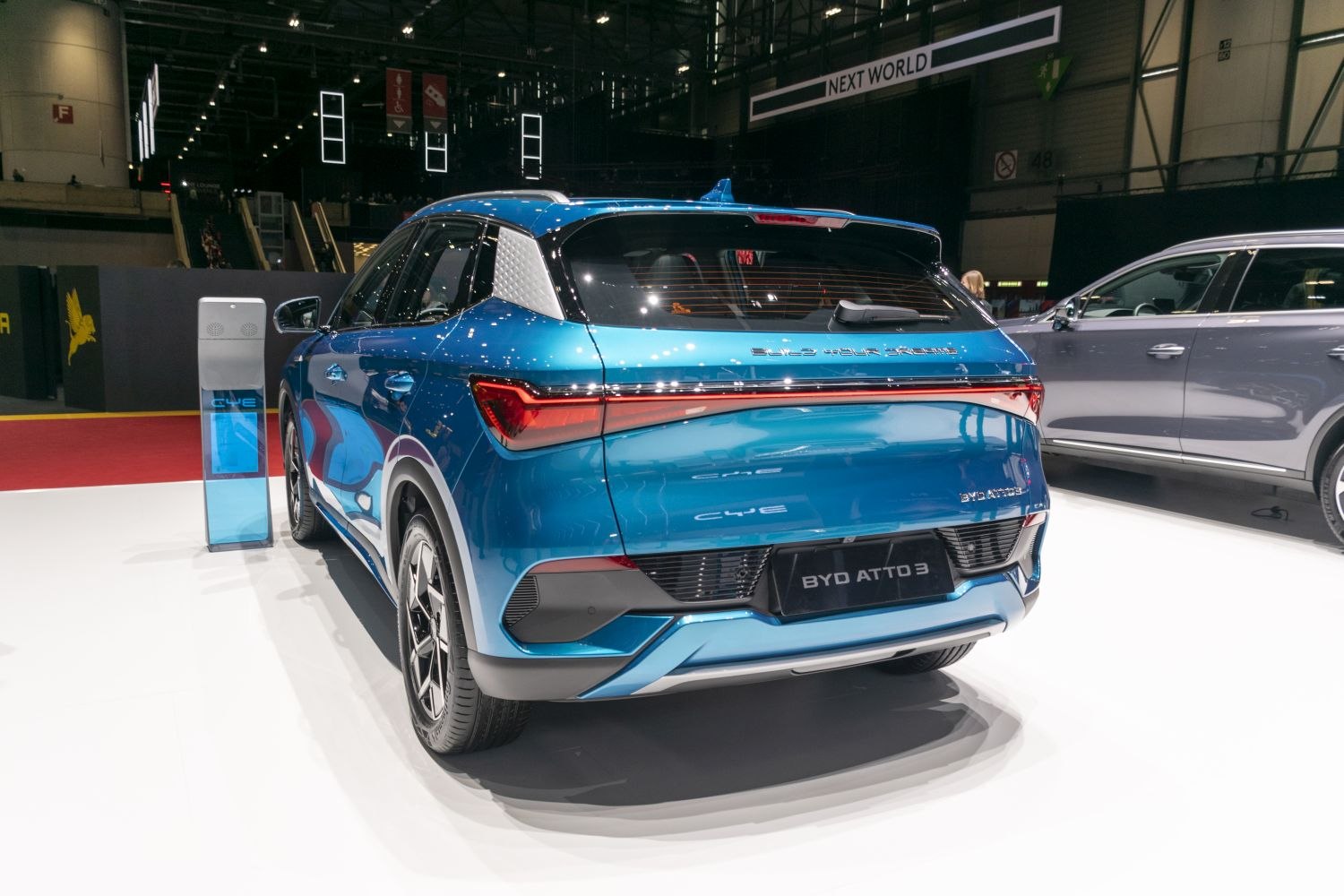 Rear view of modern electric SUV with distinct rear lights and blue metallic finish