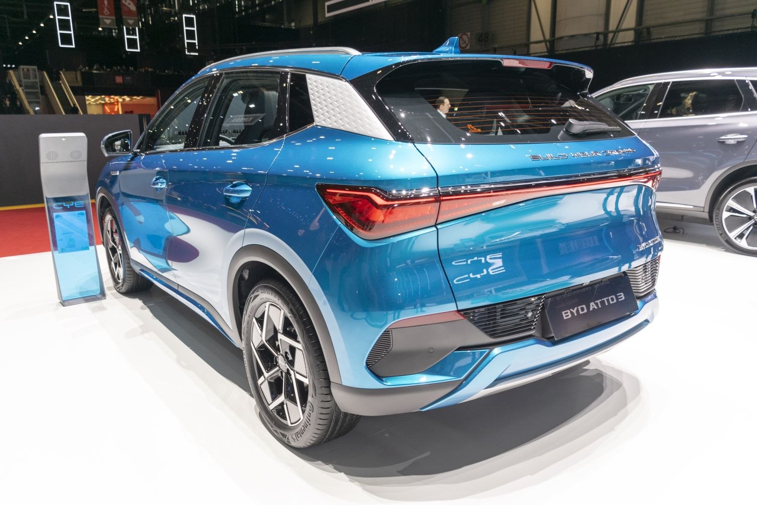Rear and side view showing distinctive taillights and textured C-pillar detail on a modern electric SUV.