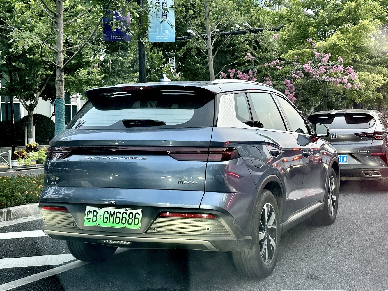 Rear view of SUV with sleek LED taillights and green license plate
