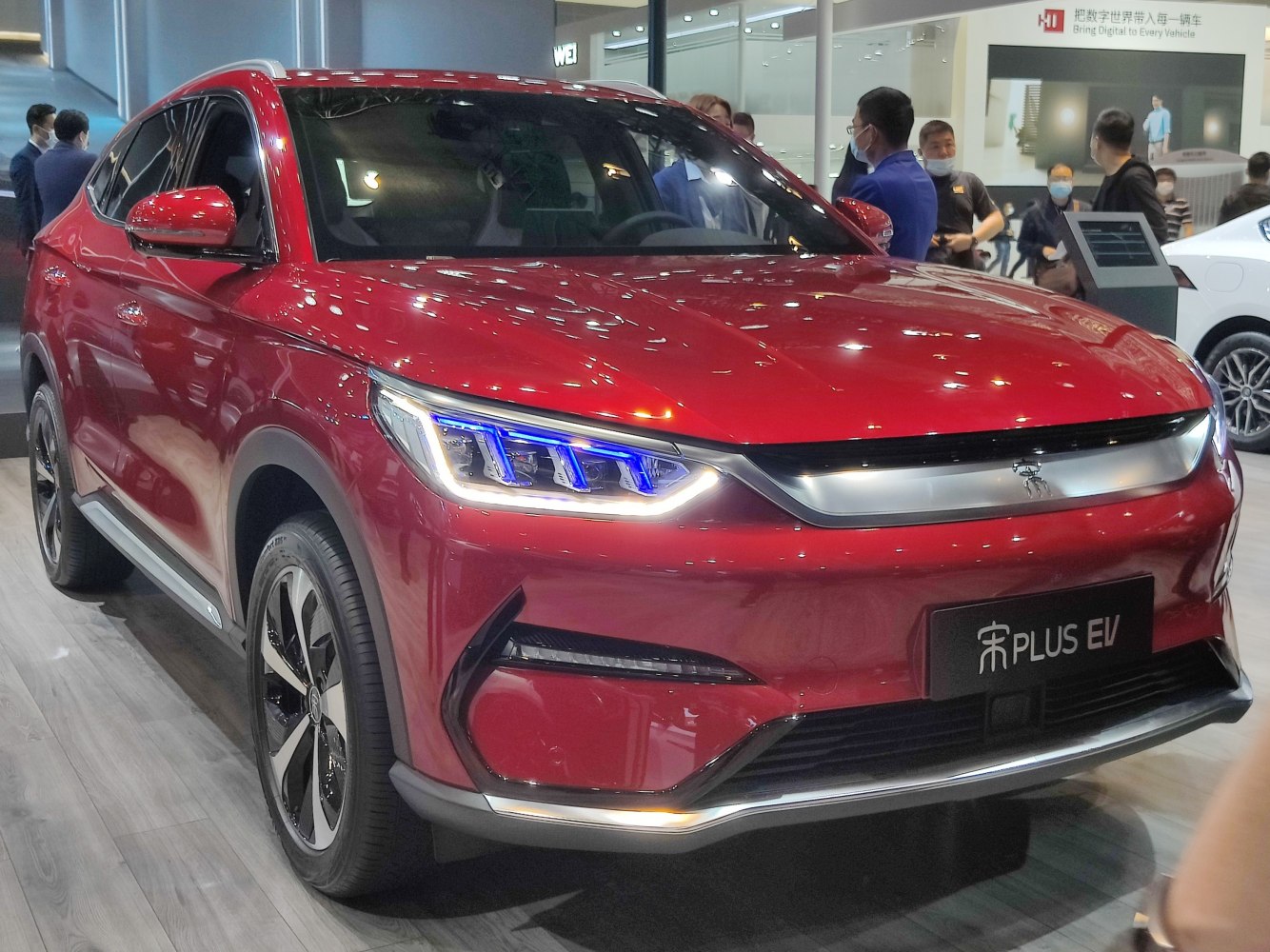 Red electric SUV with LED headlights and aerodynamic design