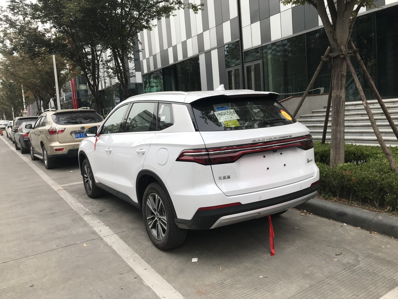 Rear exterior of an SUV with LED tail light bar and modern design