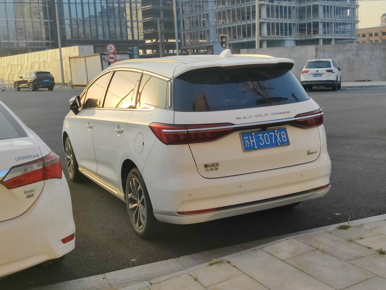 Rear and side profile with sleek tail lights and tinted rear windows