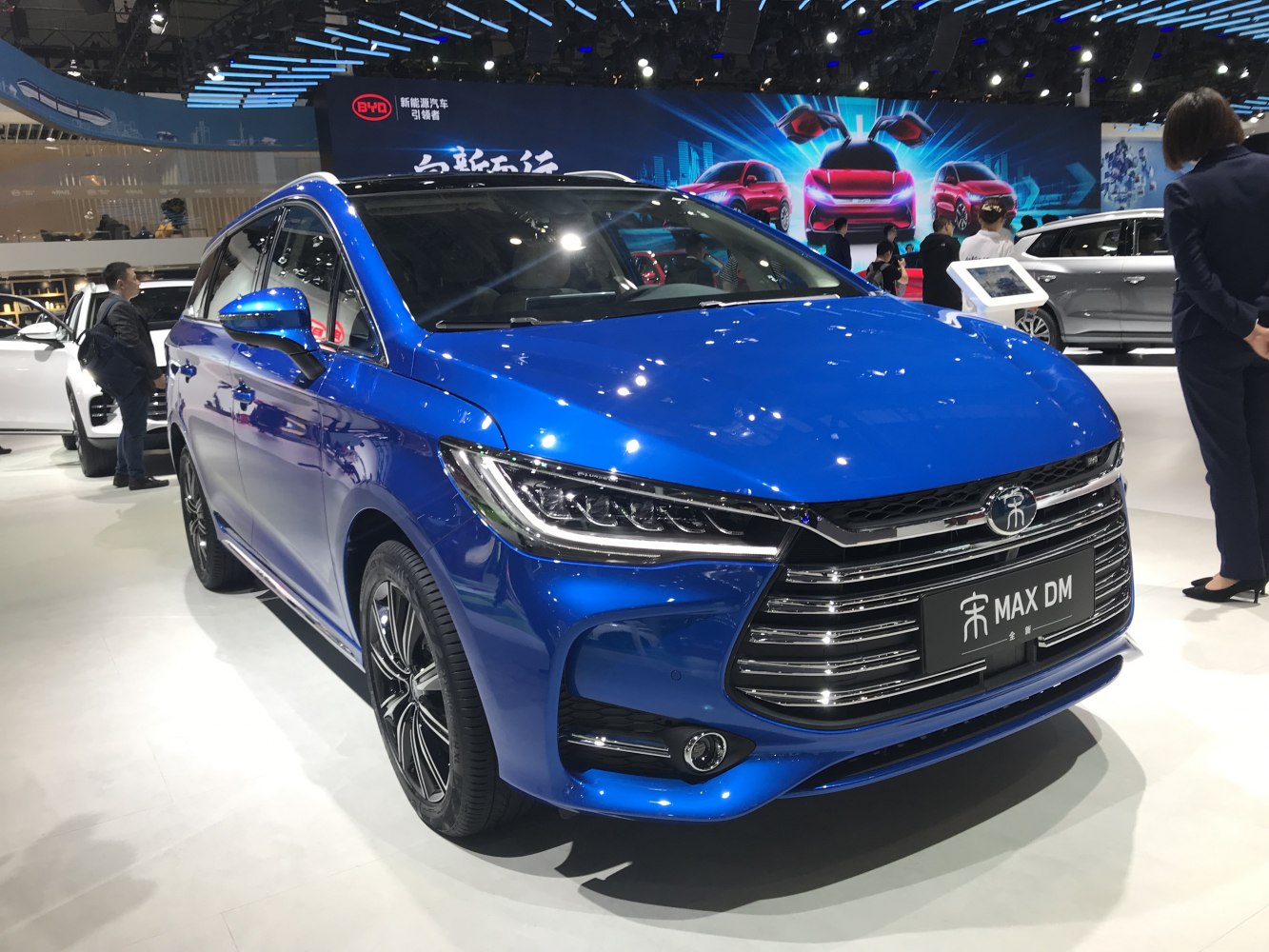 Blue compact MPV with LED headlights and chrome grille