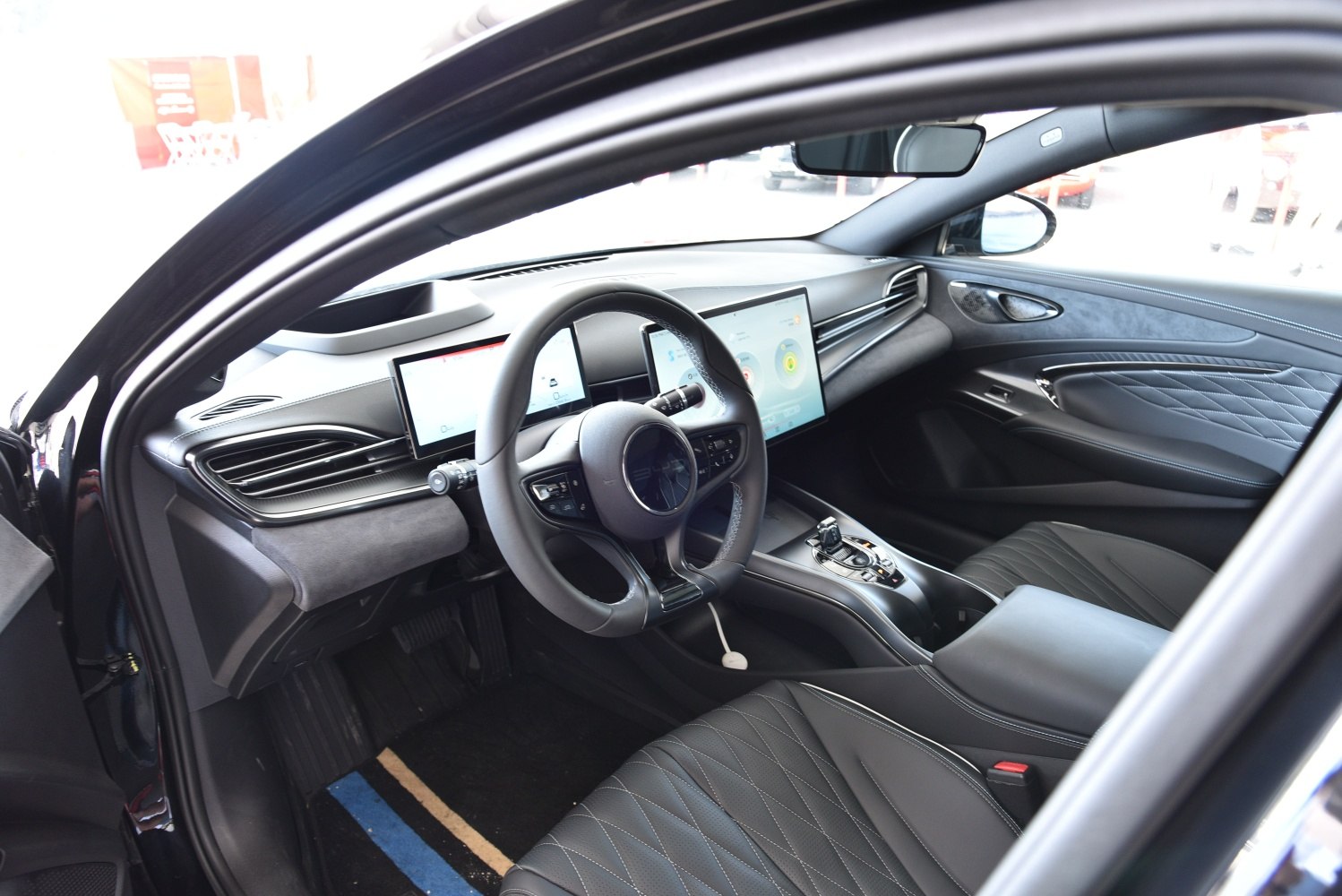 Dual digital screens, advanced steering controls, quilted leather seats interior