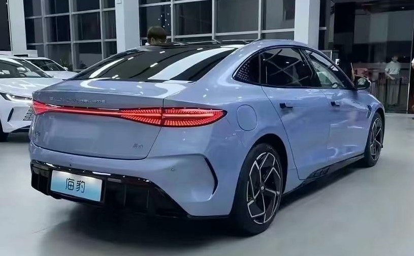 Sleek rear design with continuous LED tail lights and aerodynamic shape.